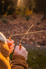 Man holding dowsing rod outside