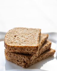 wheat bread slices close up on white background