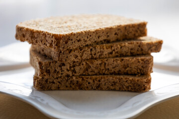wheat bread slices close up on white background