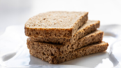 wheat bread slices close up on white background