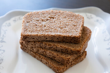 wheat bread slices close up on white background