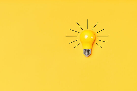 Concept creative idea with lightbulb on yellow background