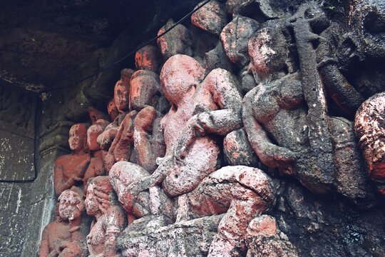 sculpture and carving at lonad caves , than city . maharashtra state , india 