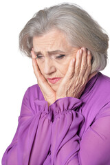 Portrait of sad senior woman posing isolated