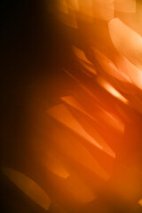 Abstract background of orange bokeh, New Year's concept. Small lights in blurry focus