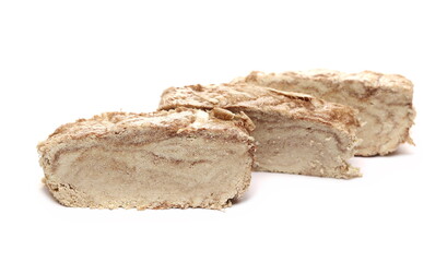 Tahini halvah, sesame paste, slices isolated on white 