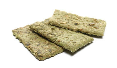 Crispbread and pumpkin seeds stack isolated on white  