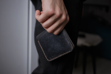 Man holding a leather wallet
