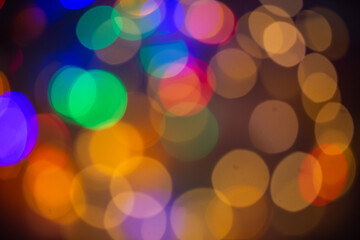Fototapeta premium colorful lights as a background, bokeh, festive background for Christmas, New Year