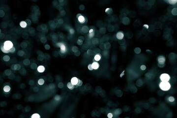 Blurred abstract green glitter texture. Tidewater Green colors. A little defocused bokeh christmas...
