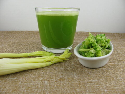 Fresh pressed celery juice with celery pomace