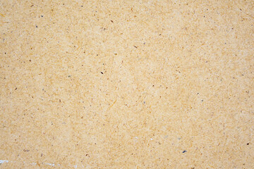 fiberboard board texture, blank kraft paper sheet for decoration, retro grainy surface background, textured vintage wall made of natural fiber, decorative and design handmade brown cardboard