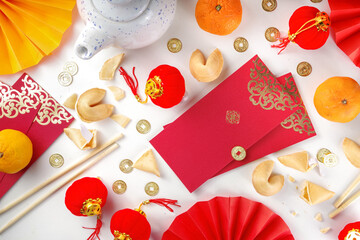 Chinese new year background. Red and golden yellow flatlay with traditional Chinese new year decor,...