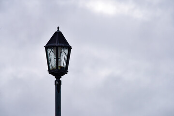 Fototapeta na wymiar old street lamp on sky