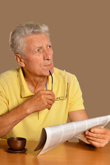 Senior man reading newspaper