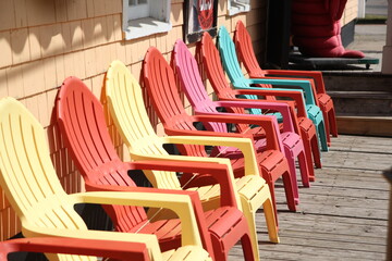 Colorfull beach chairs found on various settings