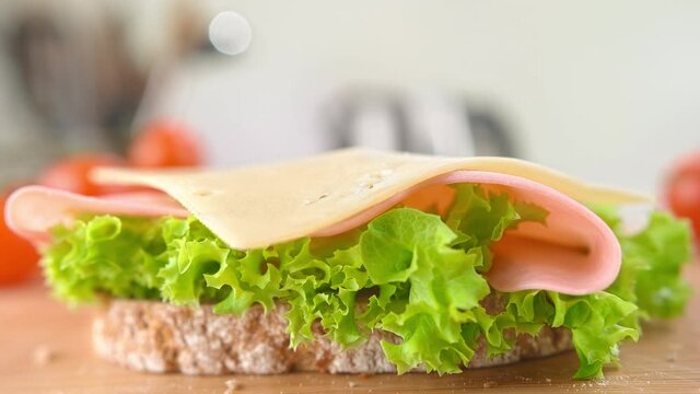Sandwich with Lettuce, Ham and Slice of Cheese Falling in Slow Motion 1000fps