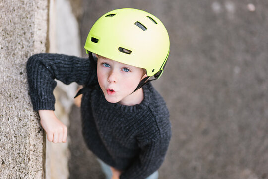 Cute Boy In Helmet Near Border