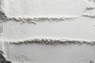 Flour or white powder background.