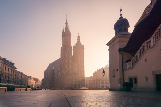 Empty square with medieval buildings in sunrise