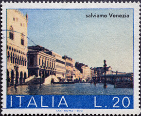 Italy - circa 1973: a postage stamp from Italy showing the Riva degli Schiavoni with high water in Venice