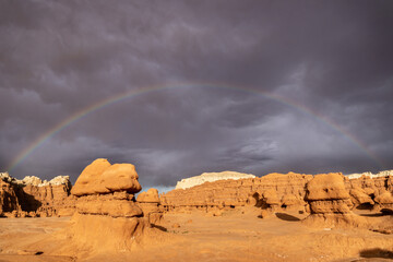 Hoodoo formations, created by sandstone erosion, in a desert landscape in Goblin Valley State Park...