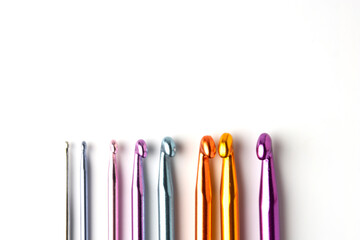 Crochet hooks set in special case, on white background. Craf and knit concept.