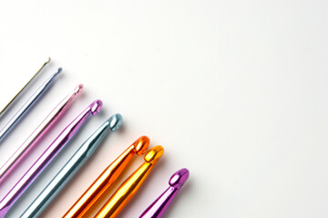 Fototapeta premium Crochet hooks set in special case, on white background. Craf and knit concept.