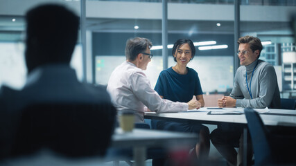 Diverse Team of Managers Working and Having Discussions in Modern Big City Office. Colleagues Work on New Business Opportunities, Management Board Having a Meeting, Talking About Investing in Future.