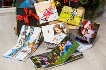 photo books near the christmas tree as a gift
