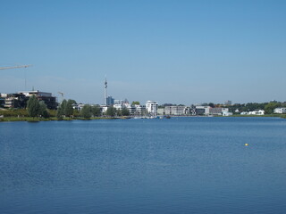Naklejka premium View of Phoenix Lake in the Dortmund suburb of Hoerde, North Rhine-Westphalia, Germany, a renatured industrial wasteland, in the background left the Dortmund TV tower