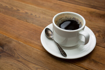 Coffee cup isolated on wooden table. Top view, flat lay coffee drink with copy space.