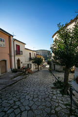 Fototapeta na wymiar Gesualdo, Avellino, Campania, Italy: downtown street with castle in the background