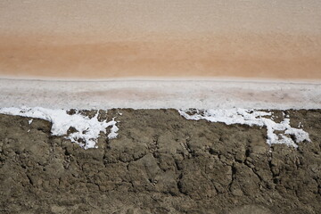 Bizarre landscape with surrealistic colours in the sea salt fields of Khok Kham (horizontal image), Samut Sakhon, Thailand