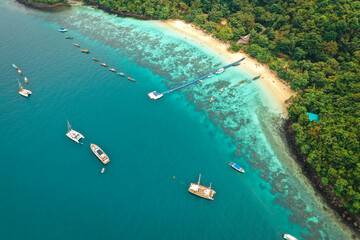 Coral island, koh He, beach and boats in Phuket province, Thailand