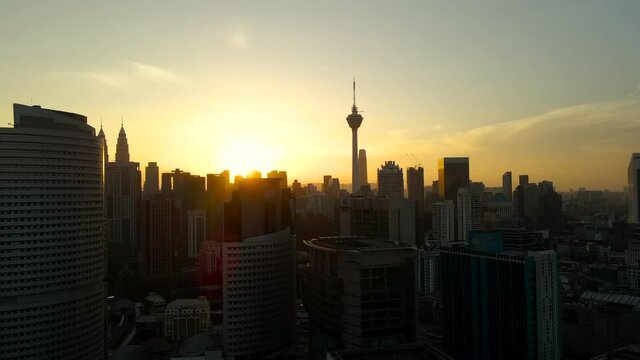 Aerial Footage sunrise view of Kuala Lumpur City Centre with four tallest skyscrapper 