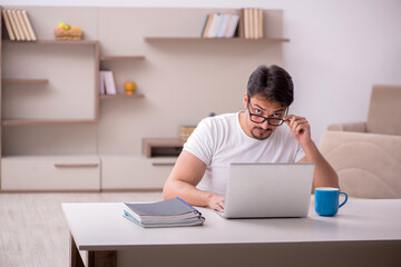 Young male freelancer working from home