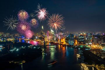 Celebration. Skyline with fireworks light up sky over business district in Ho Chi Minh City ( Saigon ), Vietnam. Beautiful night view cityscape.