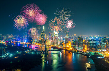 Celebration. Skyline with fireworks light up sky over business district in Ho Chi Minh City (...