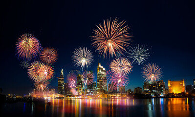 Celebration. Skyline with fireworks light up sky over business district in Ho Chi Minh City (...