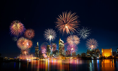 Fototapeta premium Celebration. Skyline with fireworks light up sky over business district in Ho Chi Minh City ( Saigon ), Vietnam. Beautiful night view cityscape.