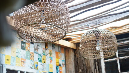 wickers hanging on the ceiling decorate the lightbulb. beautiful interior in a contemporary vintage theme of the coffee shop. a pretty interior for inspo and tourism campaign.