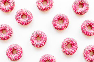 Group of glazed pink donutes. Sweet bakery background
