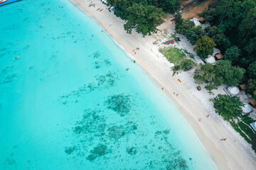 Coral island, koh He, beach and boats in Phuket province, Thailand