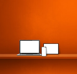 Laptop, mobile phone and digital tablet pc on orange wall shelf. Square background