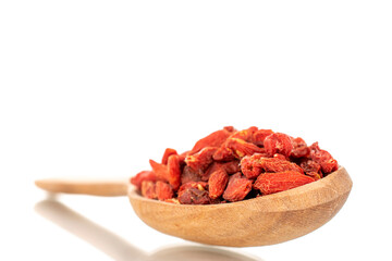 Dried sweet goji berries with wooden spoon, close-up, isolated on white.