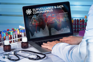 epidemiologist working with data of incidence of coronavirus or covid-19 on laptop computer on...