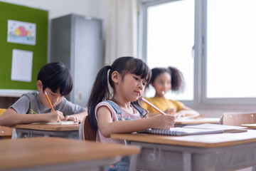 Diversity kids studying in classroom at the primary international school, Multi ethnic