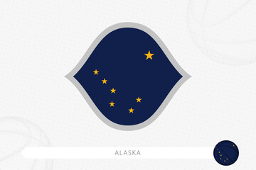 Alaska flag for basketball competition on gray basketball background.