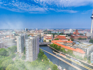 Aerial view of Berlin cityscape from drone in summer season with city landmarks and blue sky, Germany